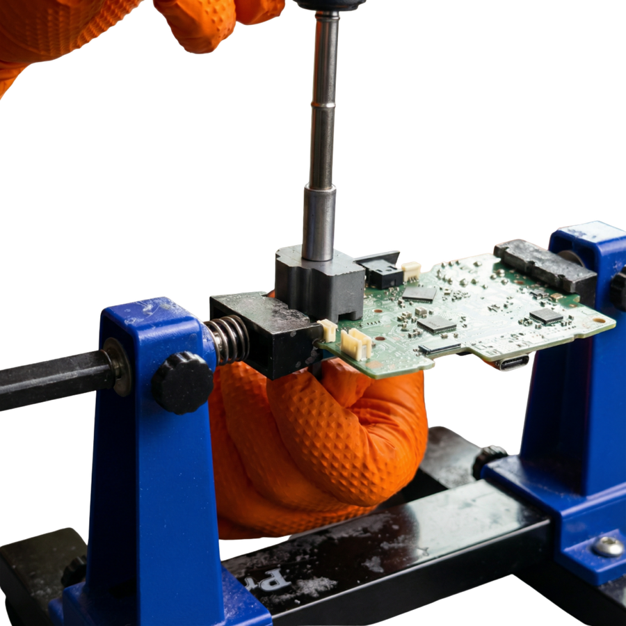 A technician working on a controller circuit board